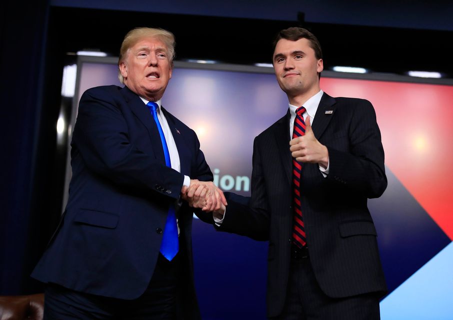 President Donald Trump shakes hands with moderator Charlie Kirk, during a Generation Next White House forum at the Eisenhower Executive Office Building on the White House complex in Washington, Thursday, March 22, 2018. Photo: AP